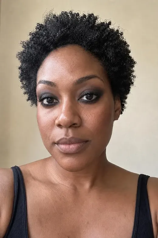 The same woman wearing a smoky eye look